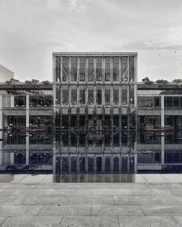 Glass pavilion and reflecting pool at The Oberoi, Gurugram