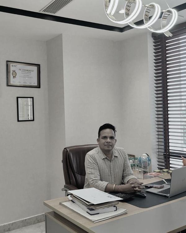 Akhilesh Singh, Proprietor of A3S Landbase, at his desk in the firm's Sector 62 office in Gurugram.